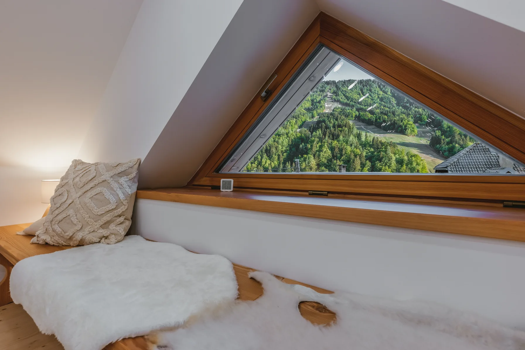 Attic window with panoramic ski slope view