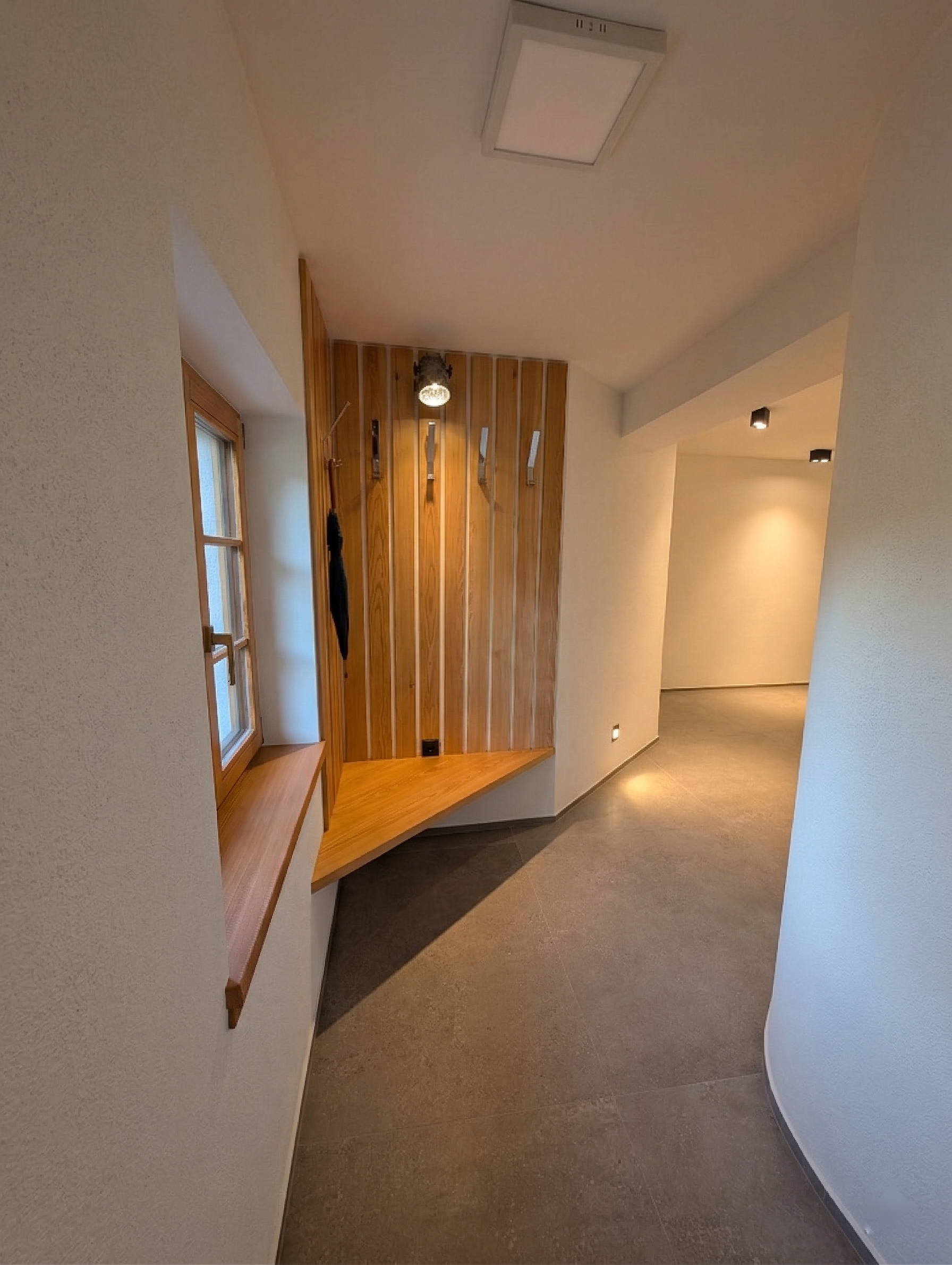 Hallway with wooden coat rack