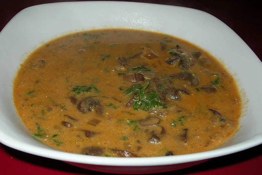 A bowl of wild-mushroom soup with herbs