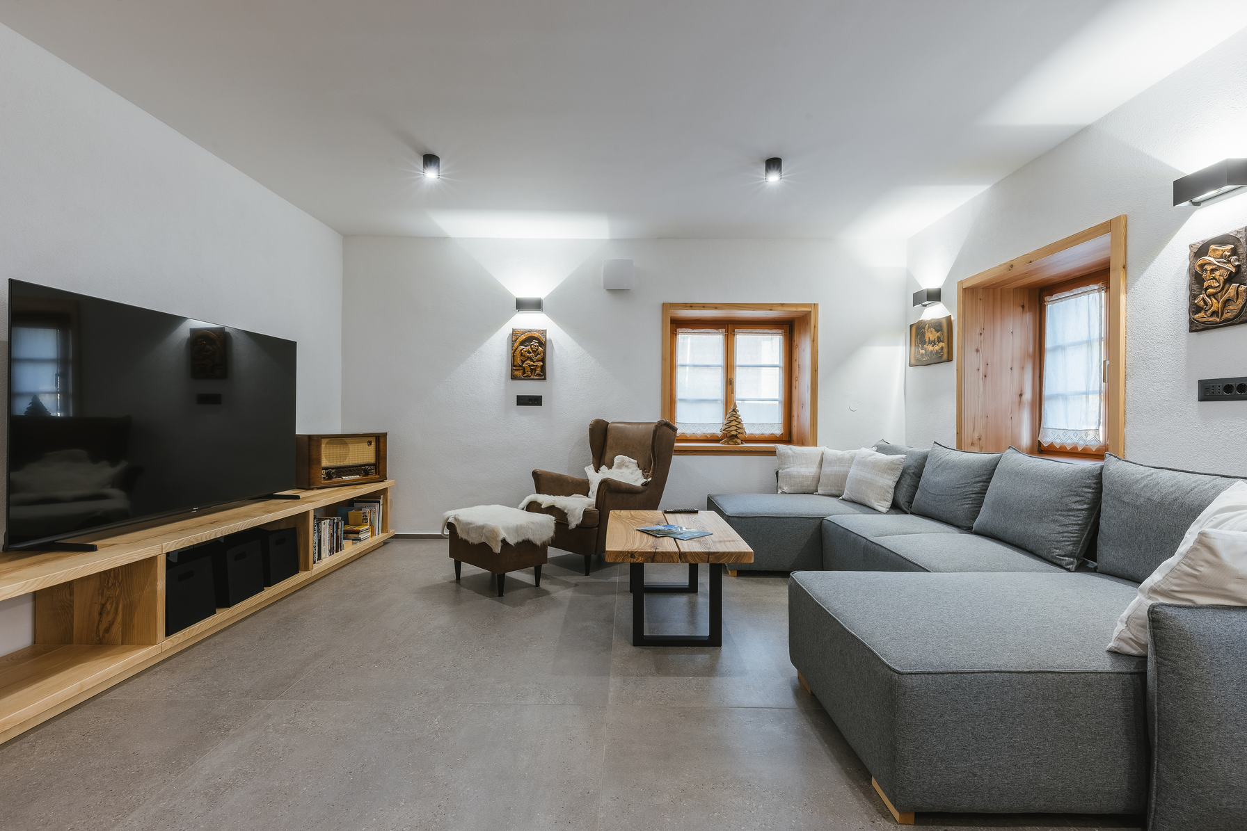 Living room with large TV and comfortable seating