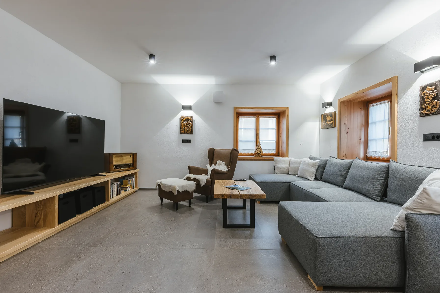 Living room with large TV and comfortable seating