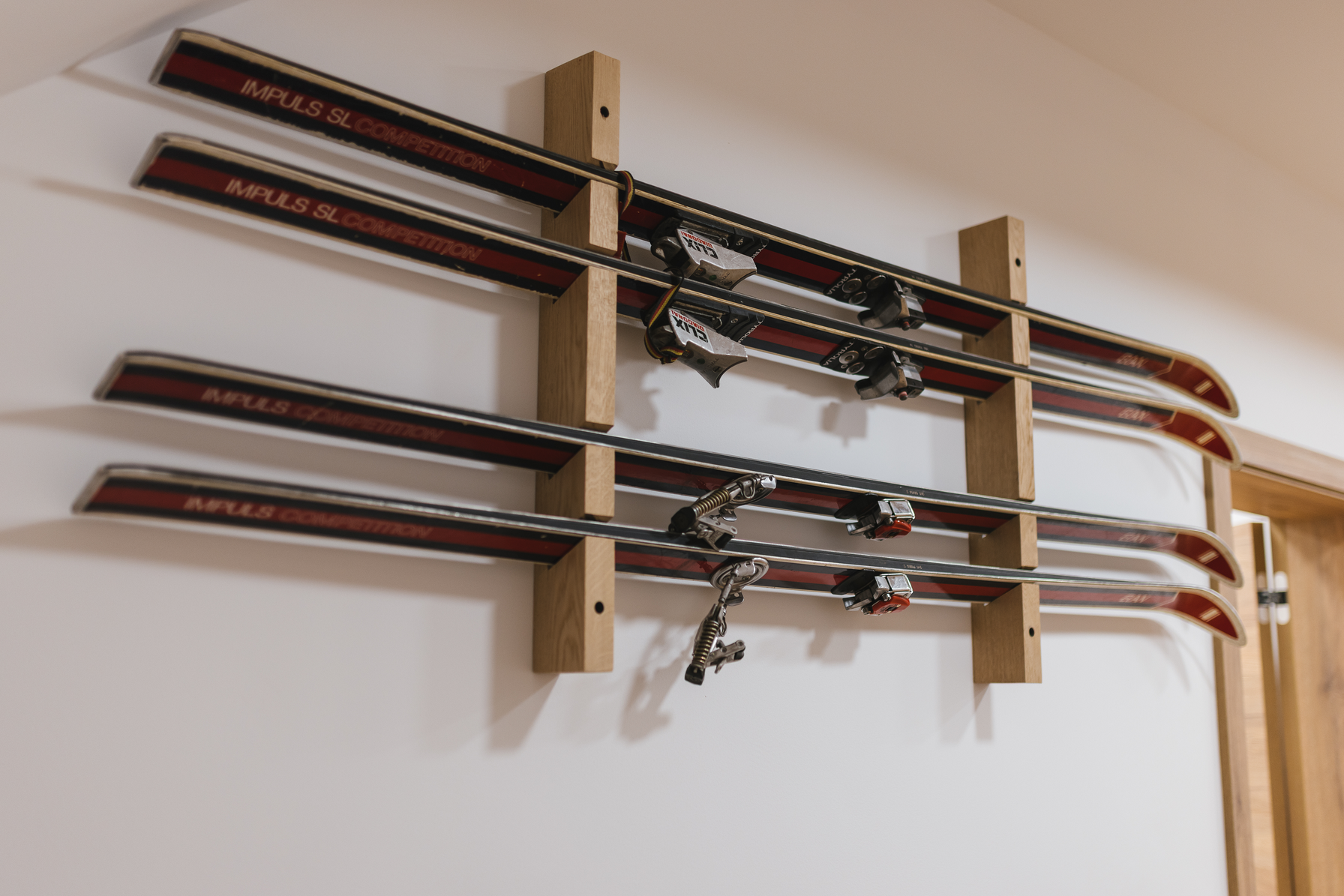 Vintage skis mounted on wall as decoration