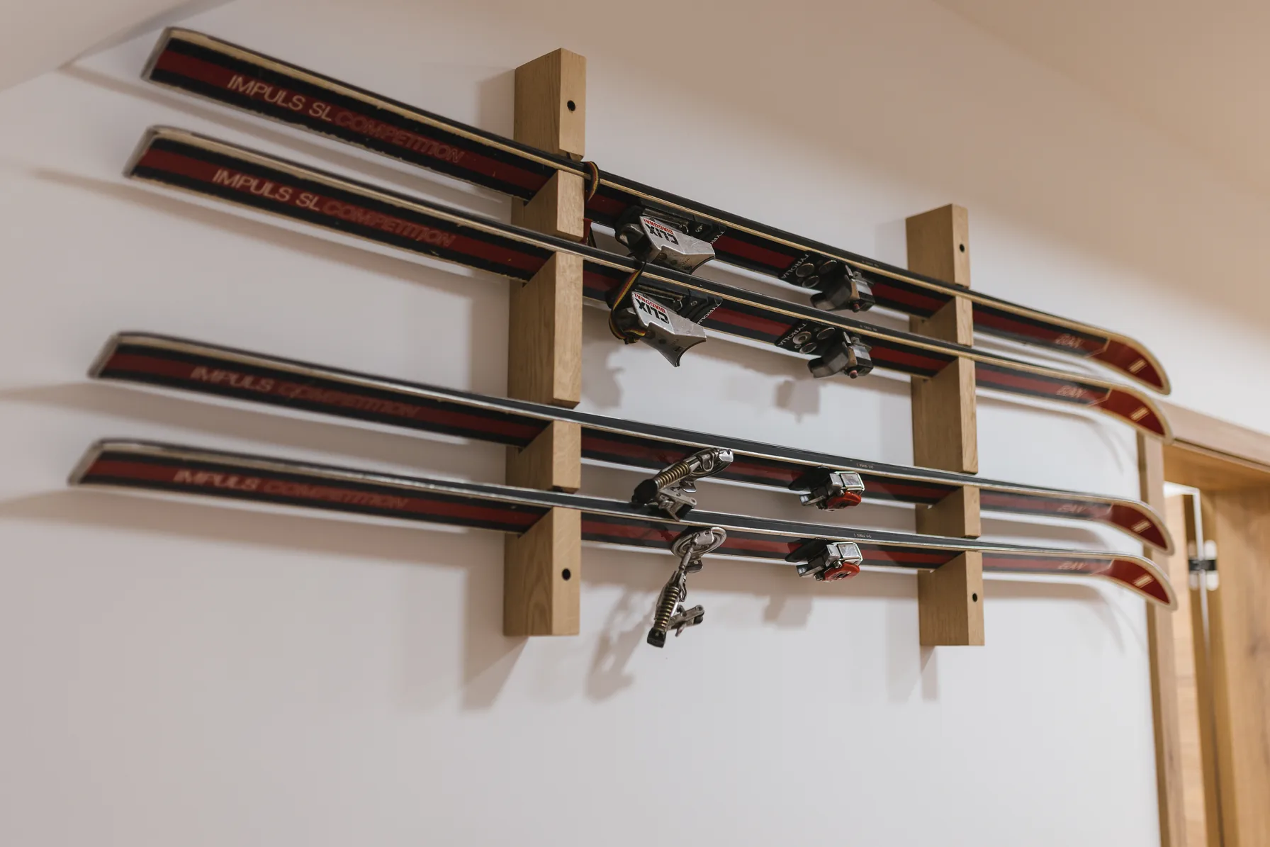 Vintage skis mounted on wall as decoration