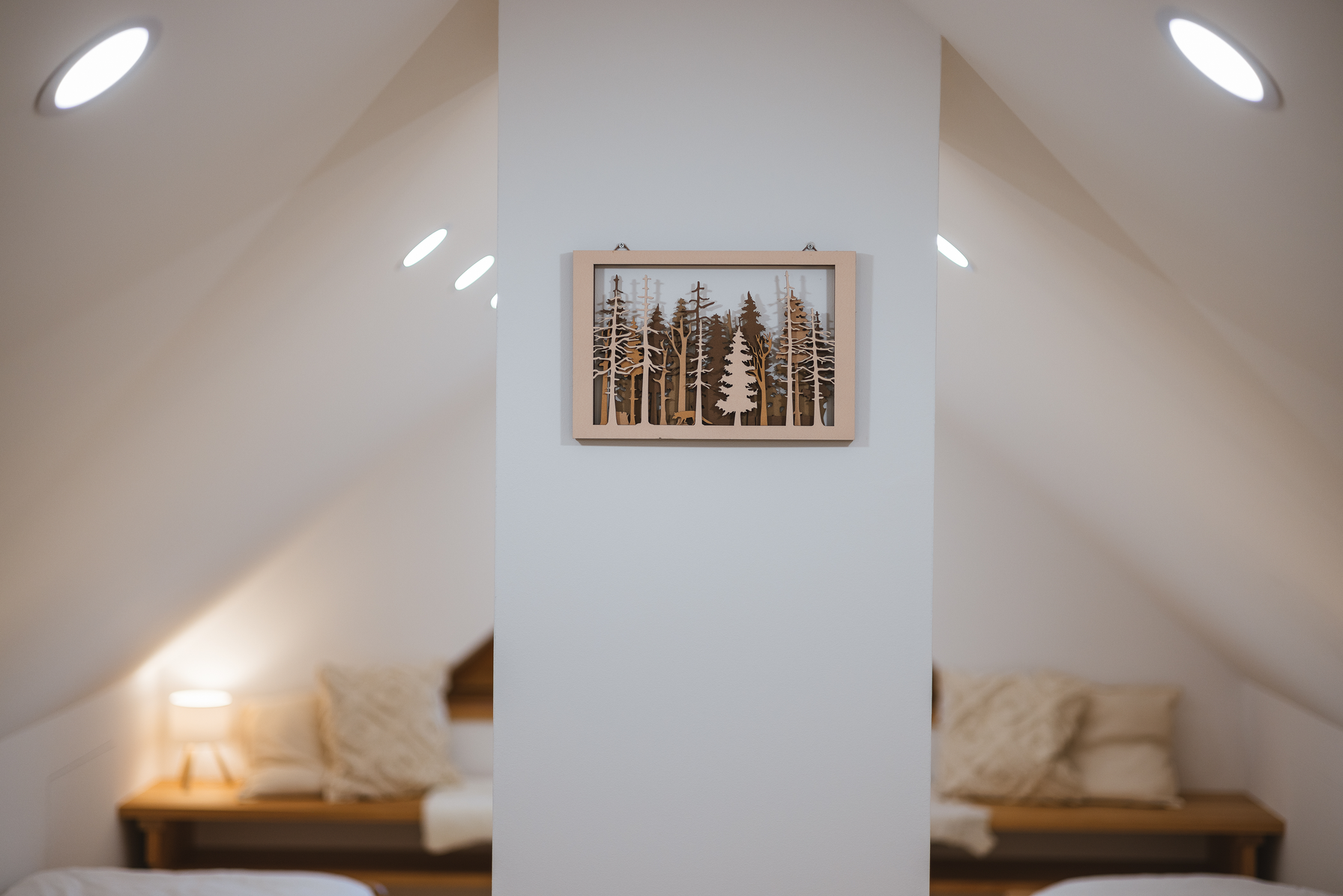 Wooden forest art on attic dividing wall